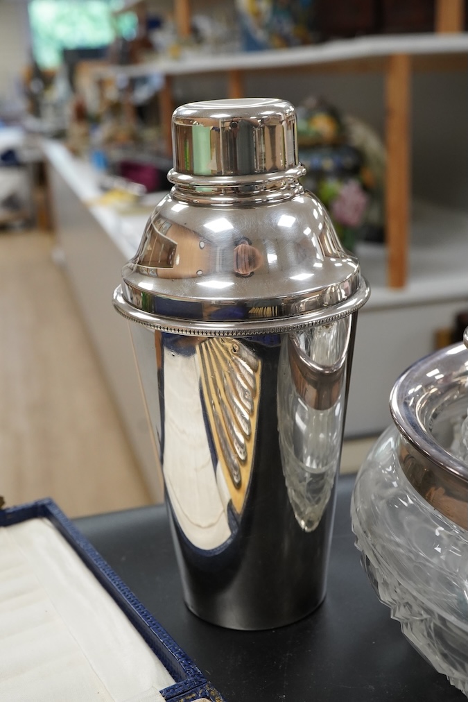 A silver christening mug, Birmingham, together with three cased sets, silver rimmed cut glass bowl, plated cocktail shaker etc